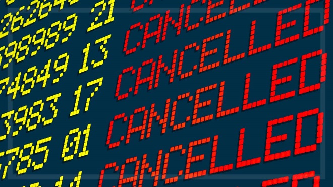 cancelled flights on an airport departures board